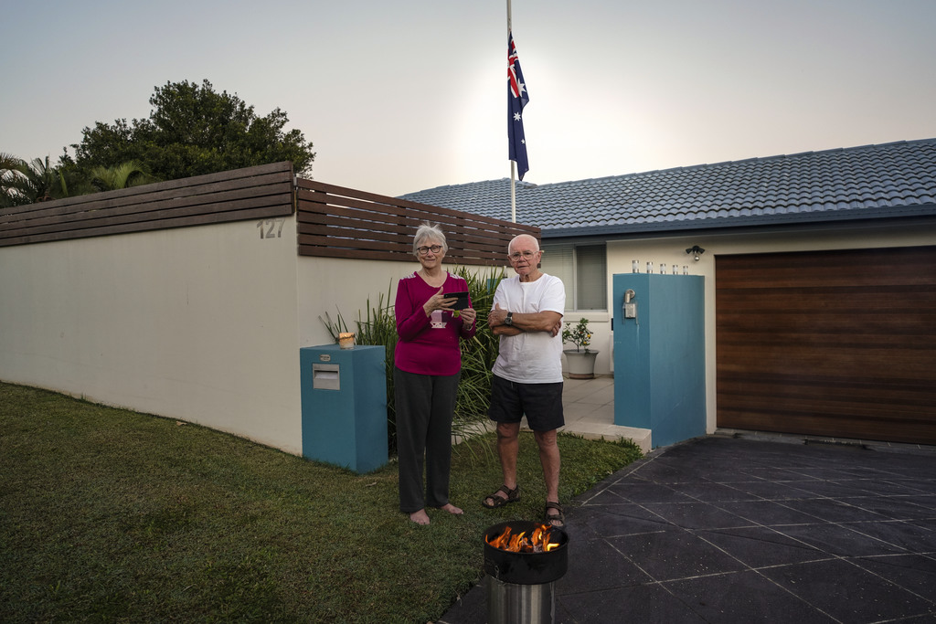 Item 05: A makeshift fire in driveway and Australian flag in yard, Anzac Day dawn service, Pioneer Parade, Banora Point, New South Wales, 25 April 2020