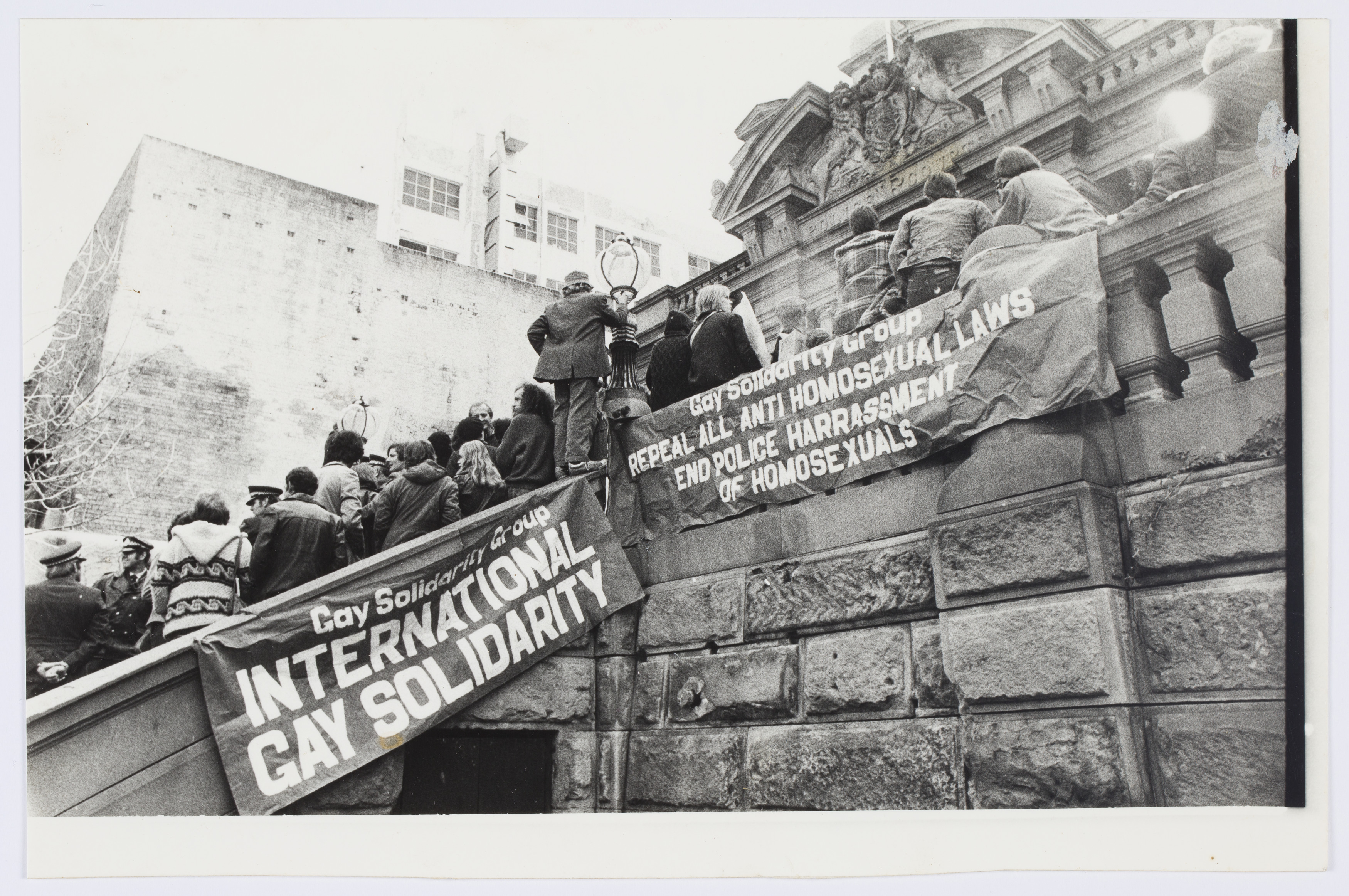 Banners: 'Gay Solidarity Group - International Gay Solidarity' and 'Repeal All Anti- Homosexual Laws End Police Harassment of Homosexuals', Central Police Court, Liverpool St, Sydney. Anne Roberts Collection