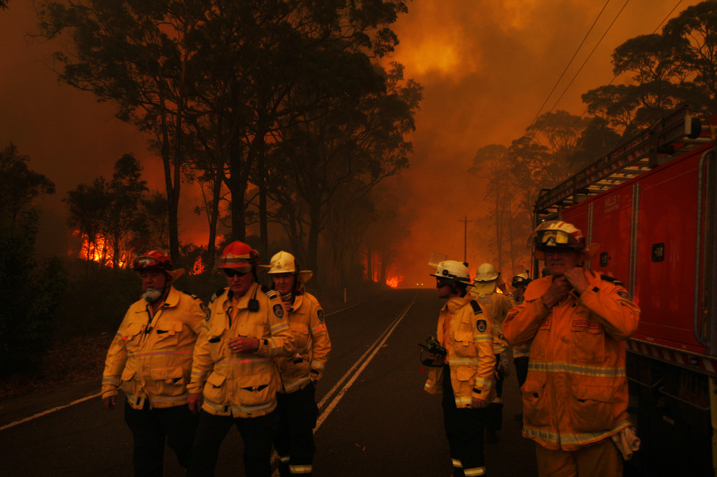 Item 24: Rural Fire Service fire fighters reconsider their approach into the south western Sydney suburb of Buxton, Green Wattle Creek fire, 19 December 2019