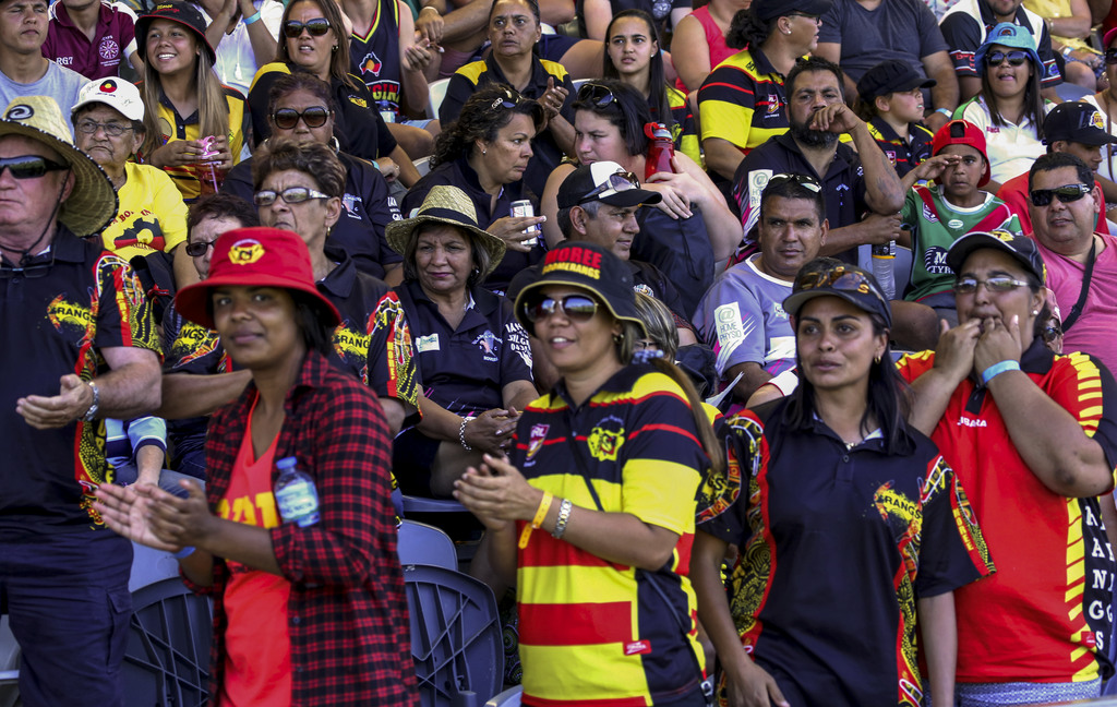 Koori Knockout supporters in stands, seated and standing.